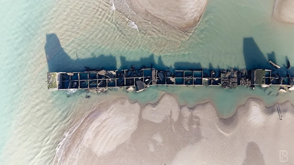 Concrete Mulberry harbour caissons off Arromanches, a stop on some Normandy tours from Paris