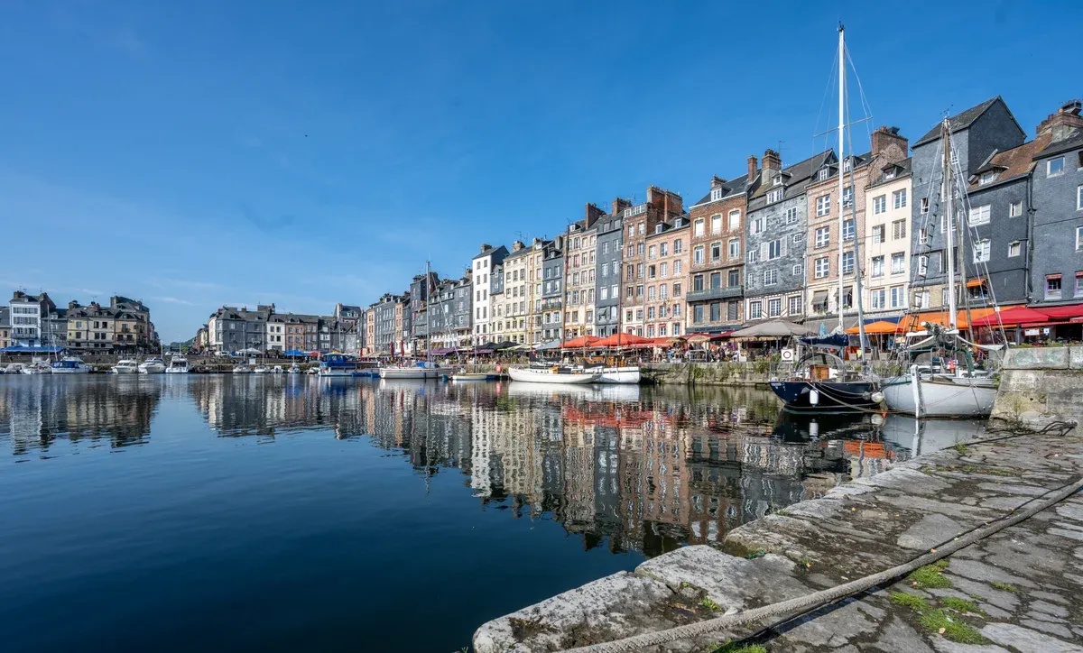 The Vieux Bassin harbour at Honfleur, visited on Normandy tours from Paris