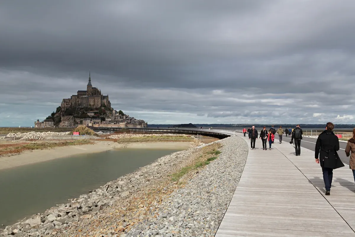 The access bridge to Mont-Saint-Michel, walked on every Mont-Saint-Michel tour from Paris, Normandy